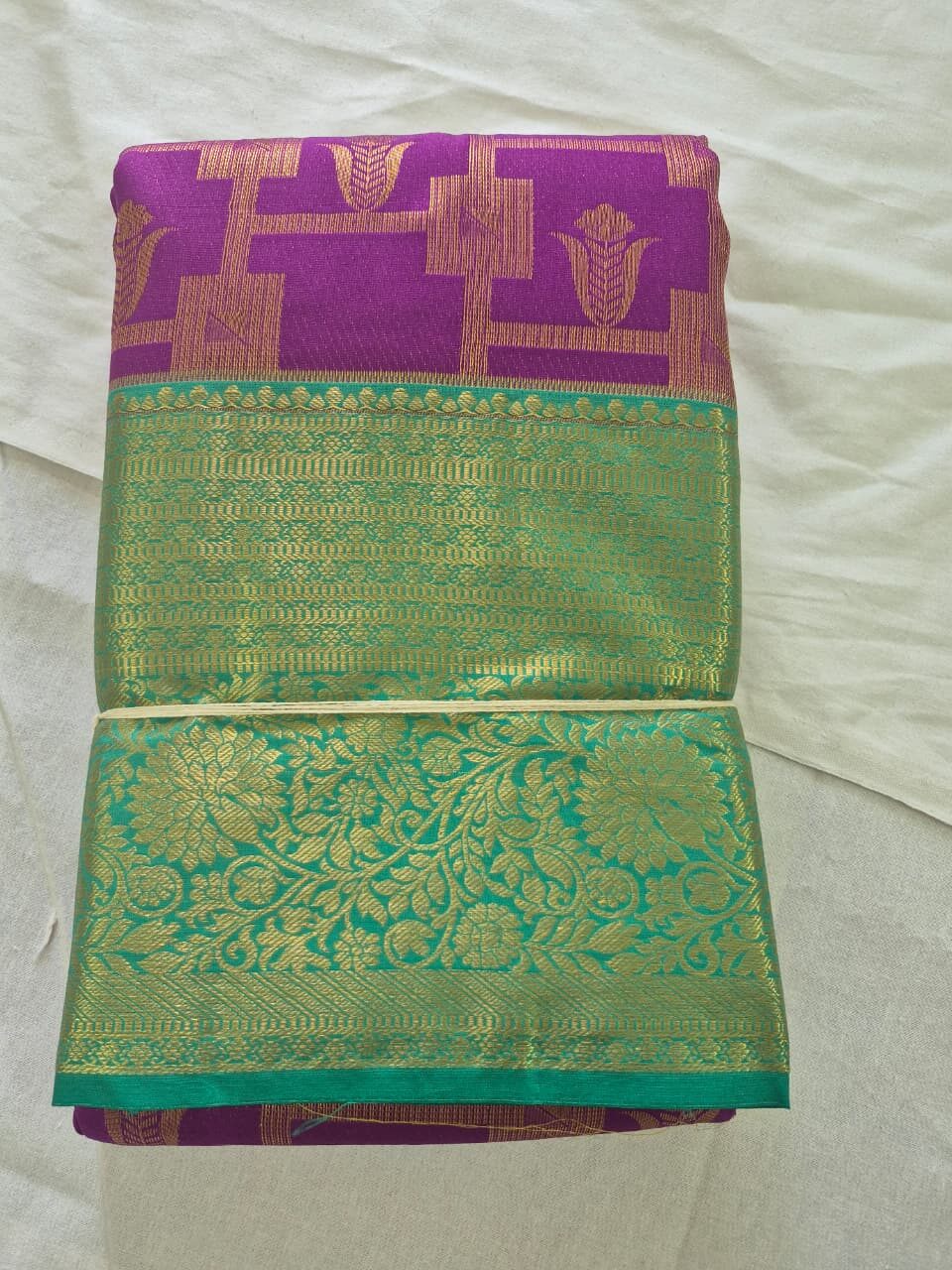 Elegant White Saree with Red Contrast Border & Designer Accents